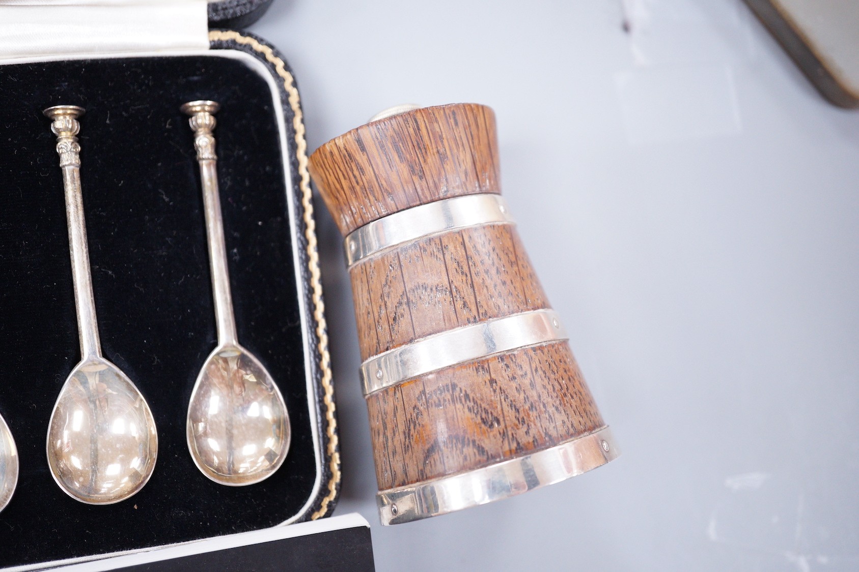 A cased set of eight George VI silver 'The Salisbury Seal Top' coffee spoons, J. Sidney Rumbridge, Sheffield, 1938, a late Victorian silver mounted wooden pepper mill and two gentleman's modern wrist watches.